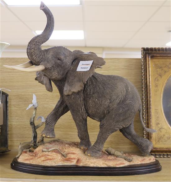 A large resin model of an elephant height 43cm
